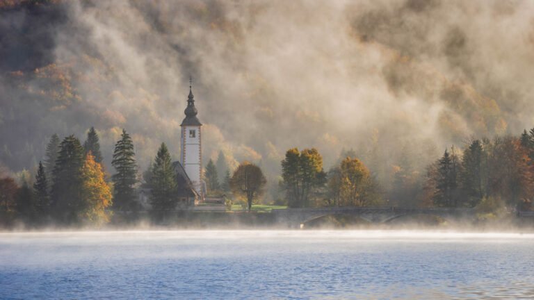 Church of Saint John the Baptist on a misty morning, Slovenia.