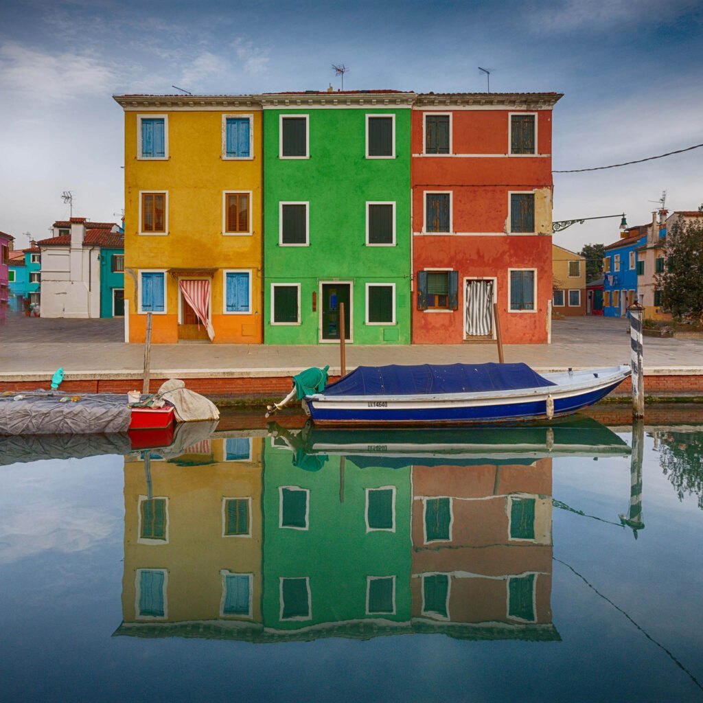 Photo of three colourful houses in Burano, Venice, Italy. Taken on my Venice photography workshops and tours.