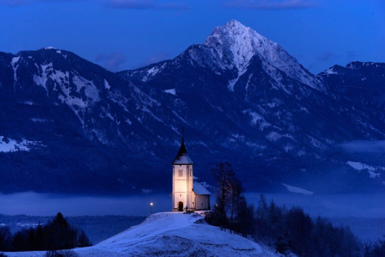 Jamnik Church in the winter snow at dawn, Slovenia.