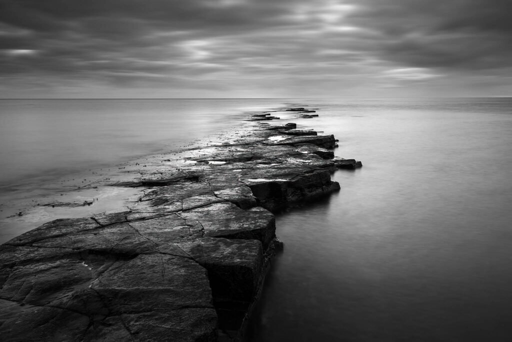 Black and white photo of Kimmeridge Bay Ledges, Dorset, Jurassic Coast, England.