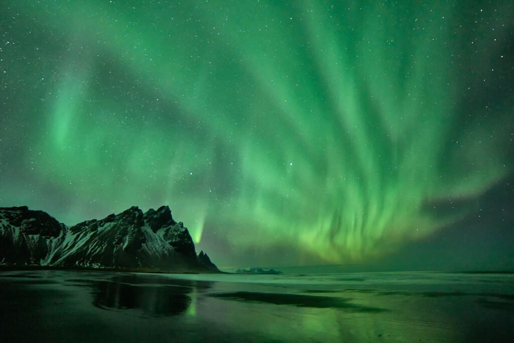 Northern Lights (Aurora Borealis) over Vestrahorn in Iceland. Taken on my Iceland photography workshop and tour.