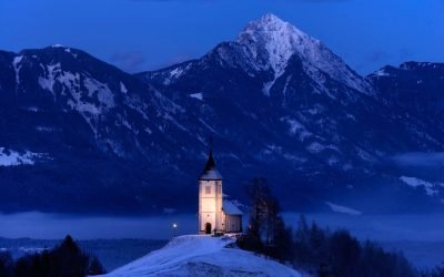 Jamnik Church in the winter snow at dawn, Slovenia.